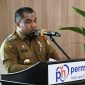Pj Bupati Aceh Besar, Muhammad Iswanto, S.STP MM memberi sambutan sekaligus membuka acara Rapat Koordlintas Program Lintas Sektor Pelaksana Kegiatan Intervensi Serentak Pencegahan Stunting di Permata Hati Centre, Gampong Meunasah Manyang, Kecamatan Ingin Jaya, Aceh Besar, Selasa (4/6/2024). Foto: MC Aceh Besar.