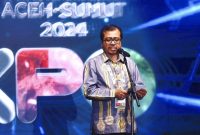 Plh Sekda Aceh Azwardi saat membuka dan menyampaikan sambutan pada PON Expo XXI Aceh-Sumut tahun 2024 di lapangan blang padang Banda Aceh, Selasa  (10/9/2024).