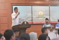 Sekretaris Daerah Aceh, M. Nasir melaunching Dashboard Peta aksi dan Partisipasi masyarakat untuk penanggulangan bencana Aceh di Gedung Serbaguna Setda Aceh Jumat (27/2/2026) Foto : Humas Pemerintah Aceh